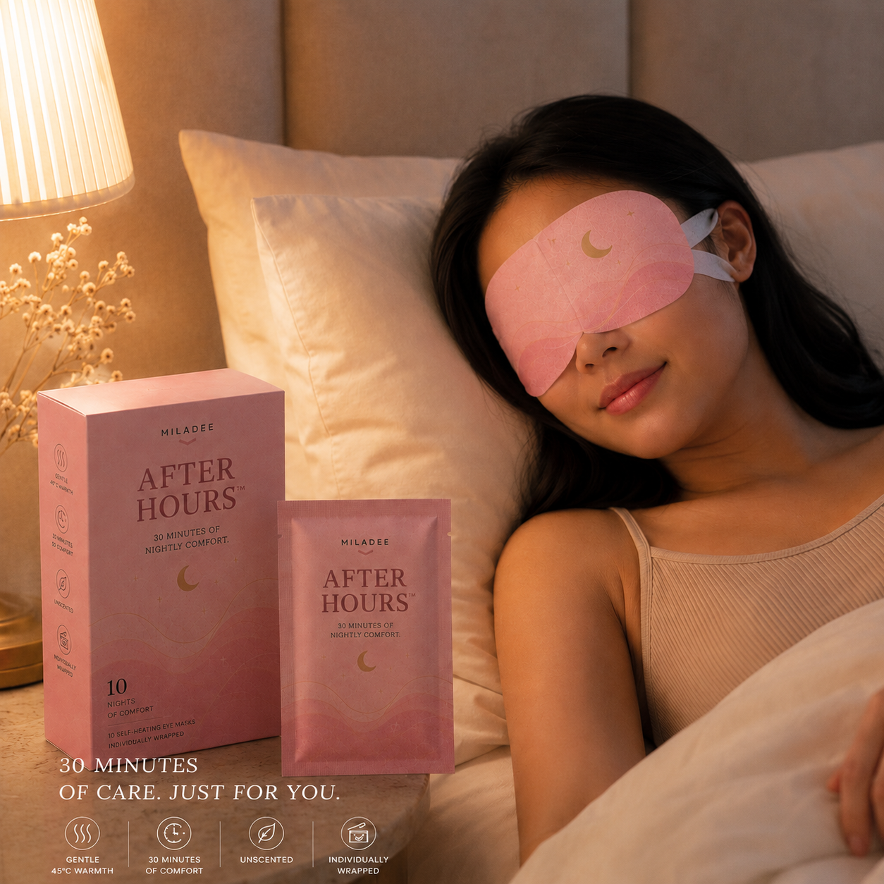 Woman wearing a pink sleep mask with 'After Hours' product packaging in the foreground.